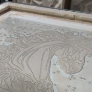 Closeup of the unicorn artisan glass piece in the fusing kiln