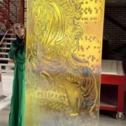 Sini Majuri, the artist, with the finished Unicorn artisan glass piece by Essis master artsans